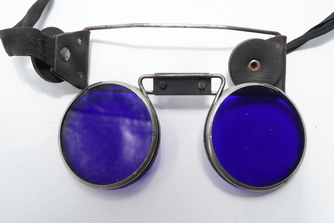 A pair of WW2 ARP fire fighter’s blue tinted goggles, stamped GR below a crown, probably by Fleming London